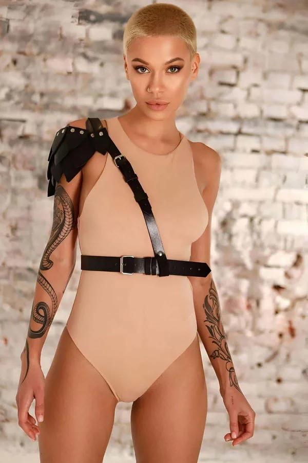 black vegan leather single shoulder harness belt layered leaf detail on shoulder and silver metal buckle