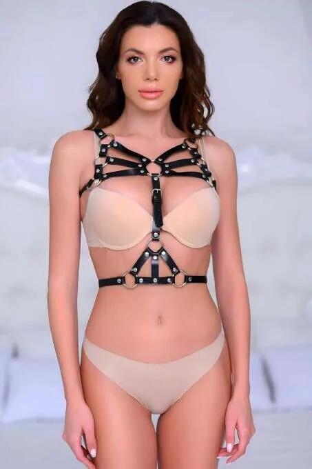 black vegan leather chest harness multiple O-ring silver snap rivet detail multi-layer strap