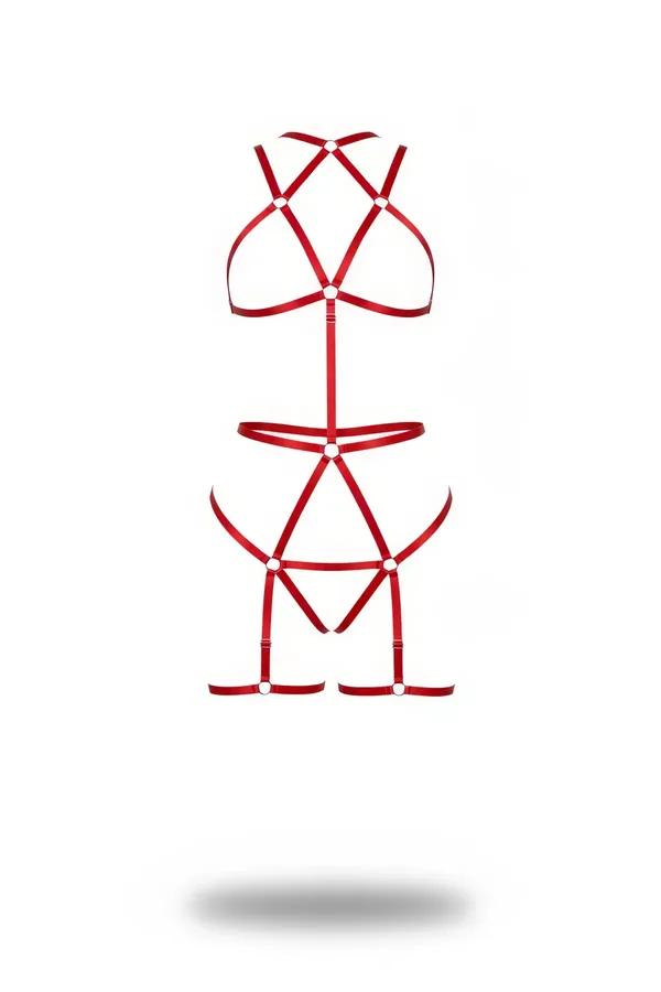Red strappy full body harness with silver O-ring connectors, geometric cage bralette, double waist band, and thigh leg garter