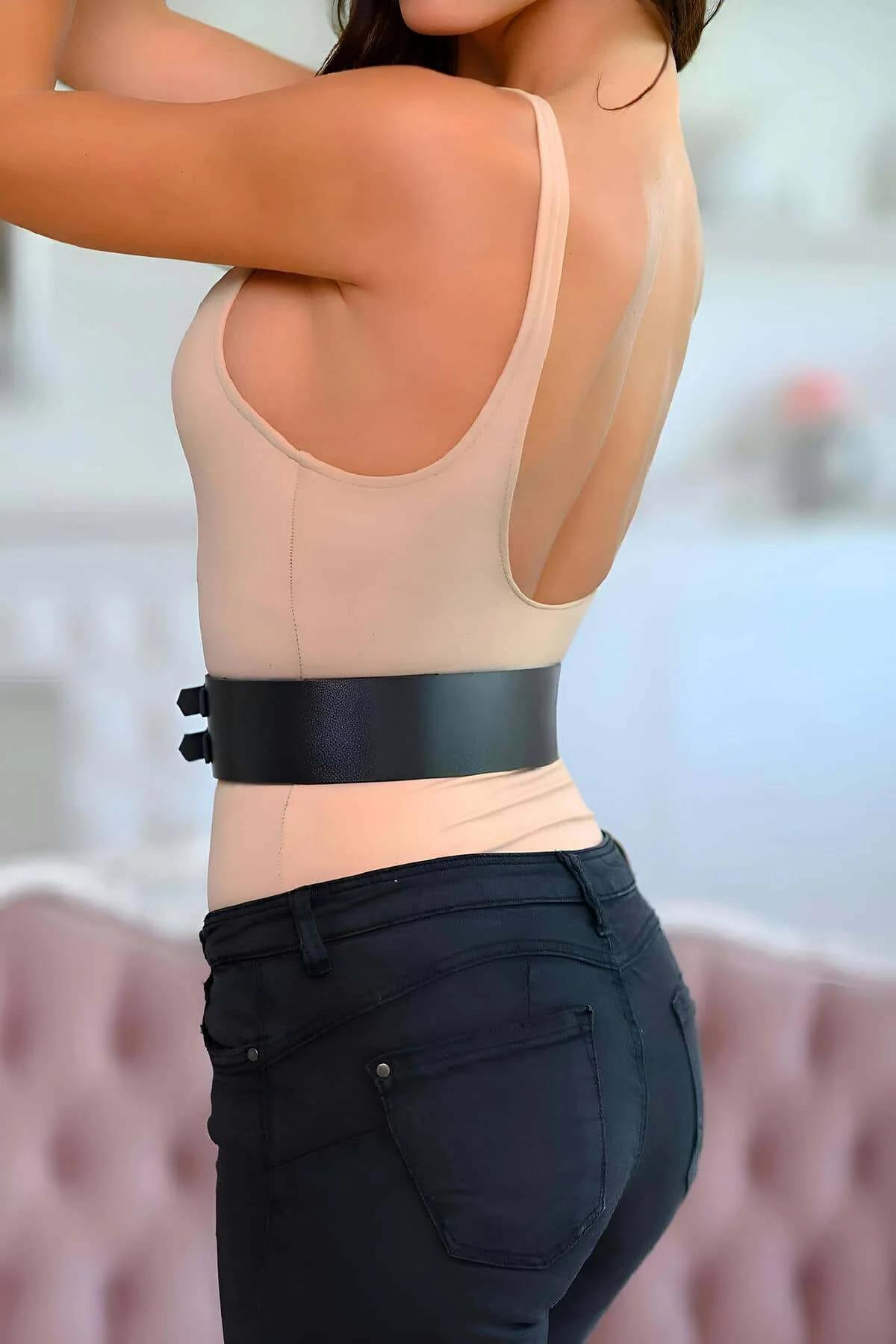 smooth PU faux leather waist belt cinching natural waist over black jeans