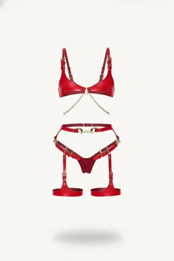 Red vegan leather harness bra and garter set with gold-tone buckles and decorative link chain connecting bra cups