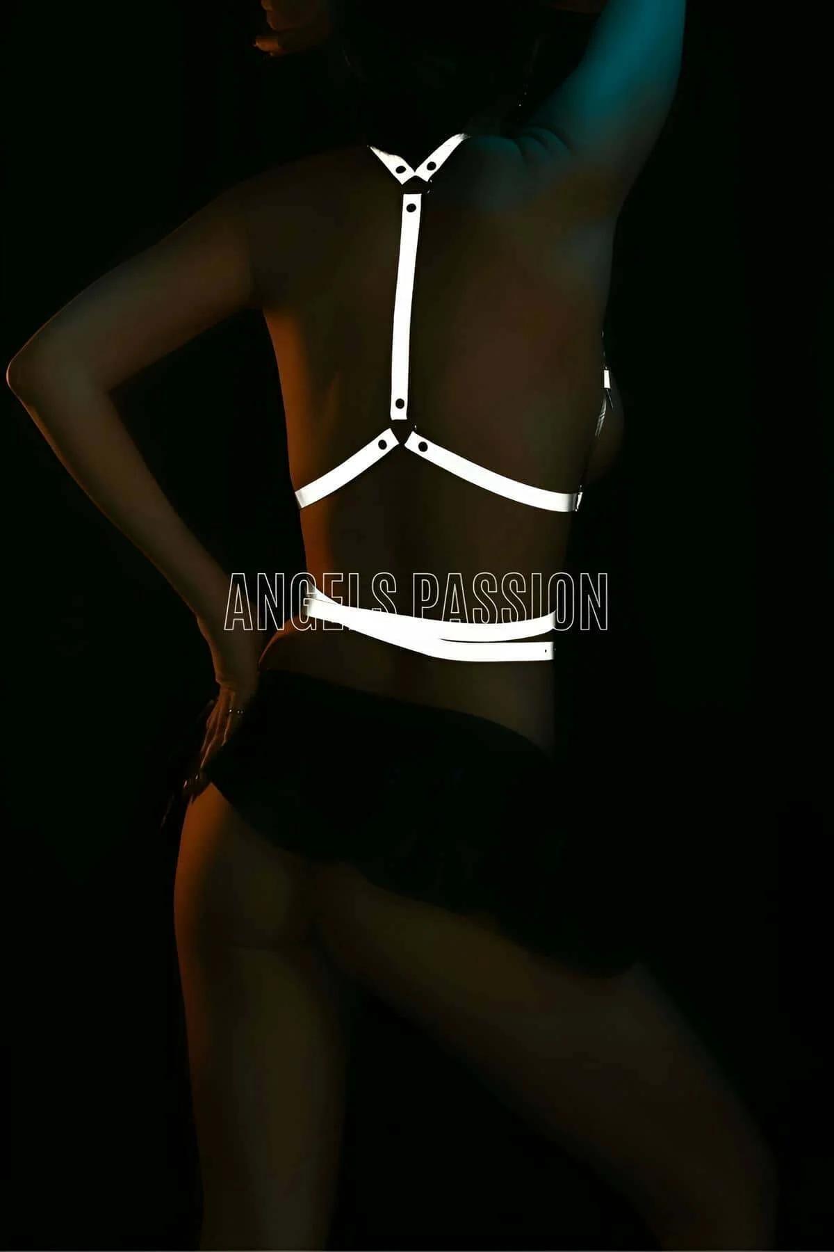 White reflective harness halter-neck chest strap configuration viewed from front torso angle