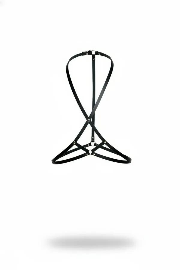Black faux leather chest harness with X-cross front straps dual O-rings and silver-chrome hardware on white background
