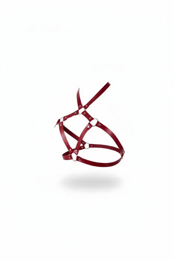 Red vegan leather caged chest harness with silver O-rings and rivet hardware, geometric strap configuration