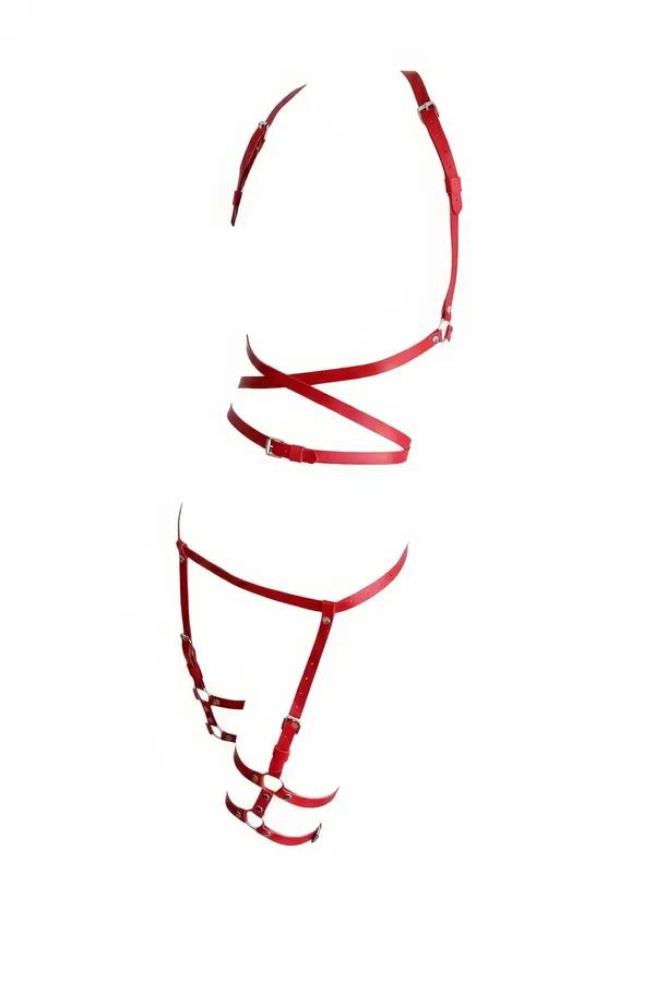 Red faux leather full body harness and thigh garter set with silver buckles and O-rings on white background