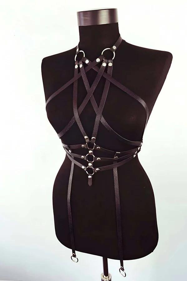 black vegan leather body harness with cross straps garter clips silver O-ring rivet detail on model