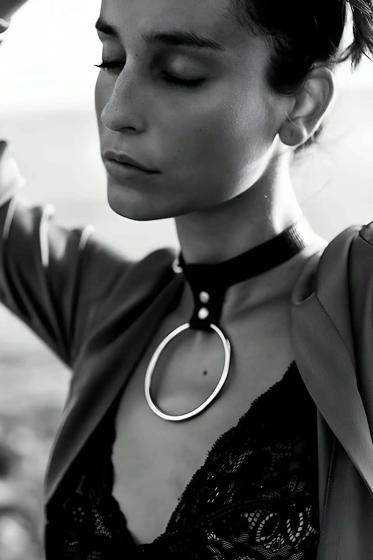 black faux leather choker with polished silver O-ring pendant from front angle