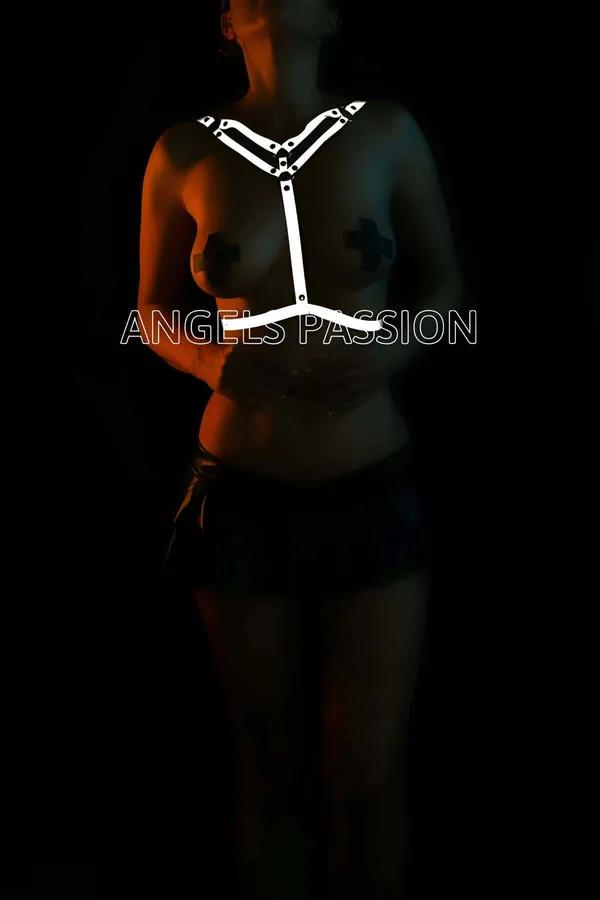 White reflective Y-front body harness with adjustable straps and silver snap closures worn over bare torso in low light