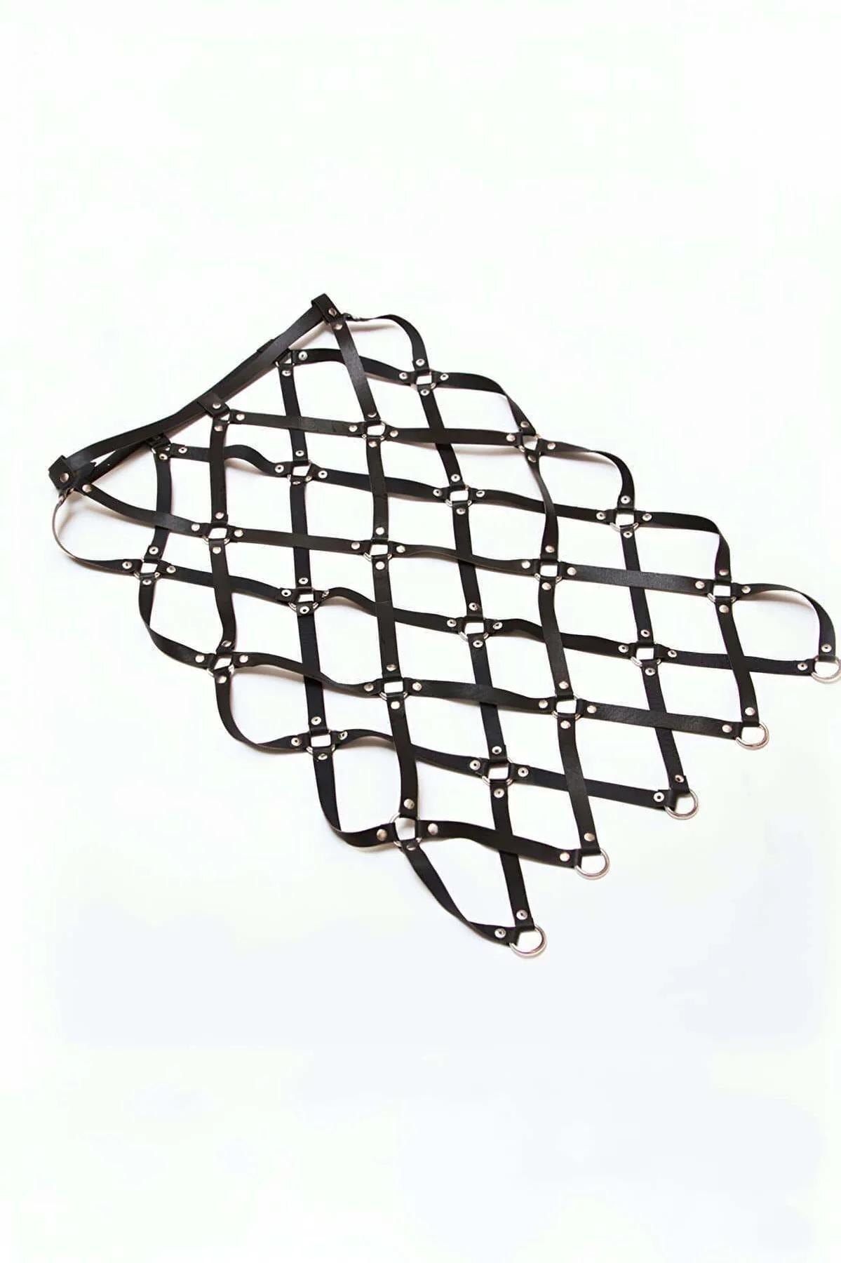 Close-up of silver O-rings connecting black faux leather straps in diamond lattice pattern