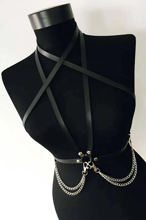 Black vegan leather chest harness with cross X straps silver chain and lobster clasp detail on model