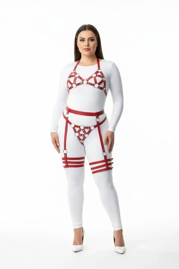 Red vegan leather O-ring harness set with bra waist band and thigh cuffs over white base layer, silver hardware