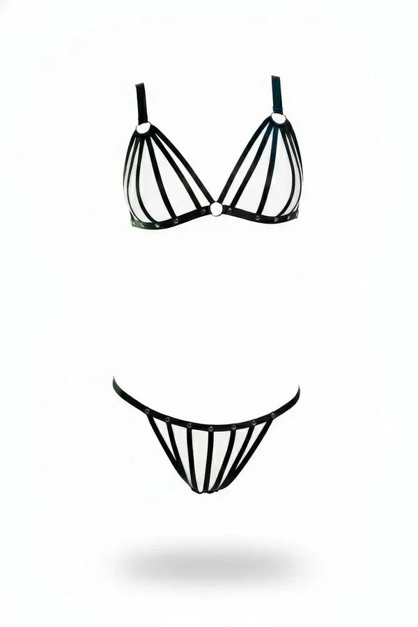 Black faux leather caged harness bra and thong set with chrome O-rings and vertical cage straps on white background
