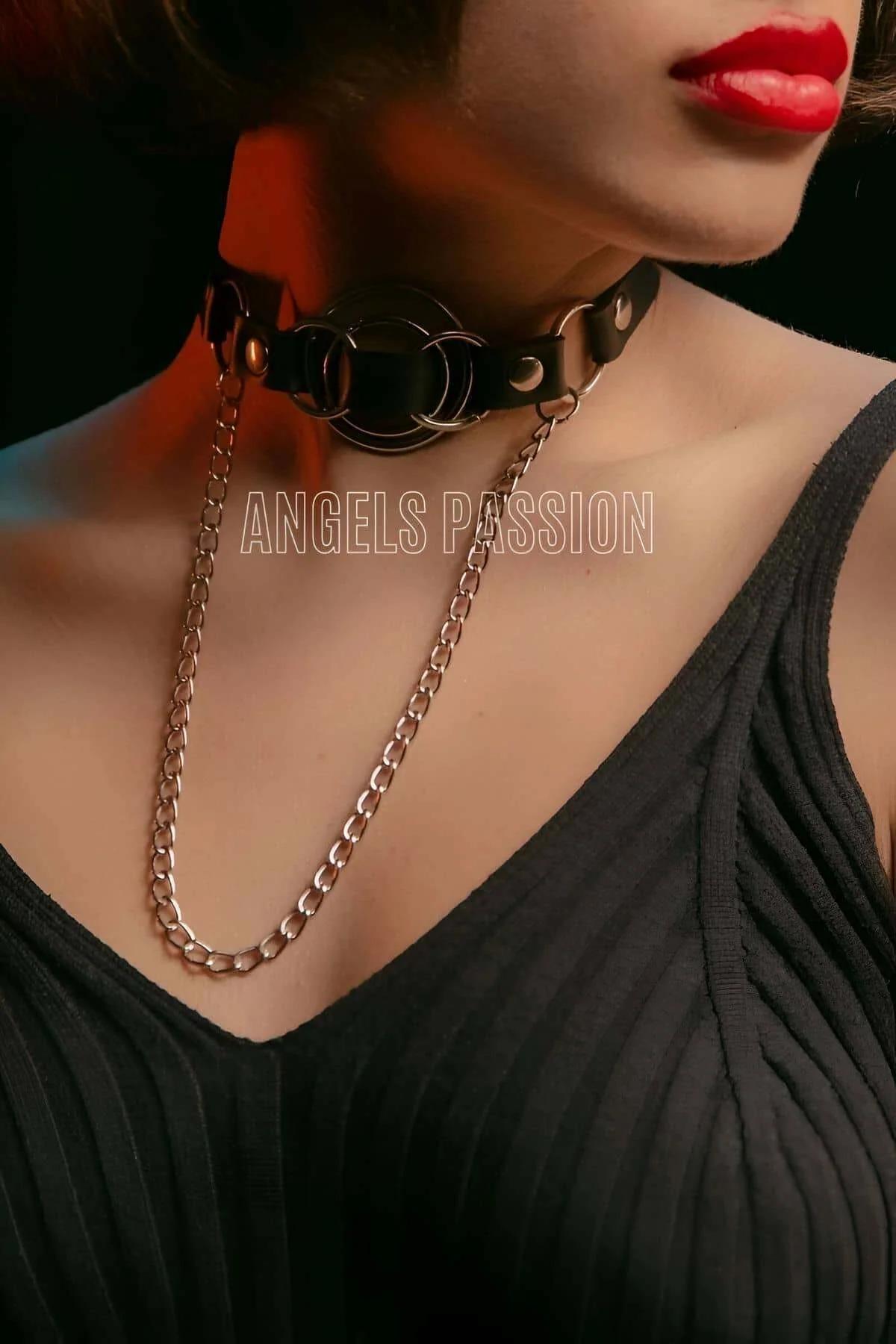 Adjustable press-stud closure detail on black faux leather O-ring choker