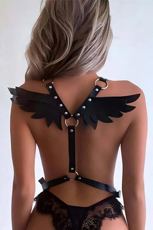 black vegan leather winged back harness multi-layer feather-form panels on shoulders and gold O-ring detail
