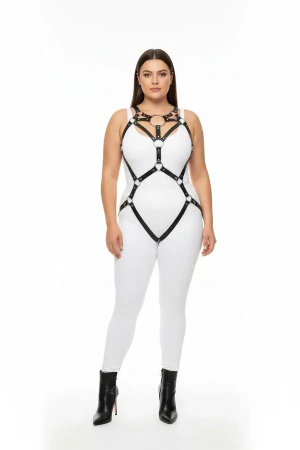 Black vegan leather full body harness with silver central O-ring and garter straps worn over white jumpsuit
