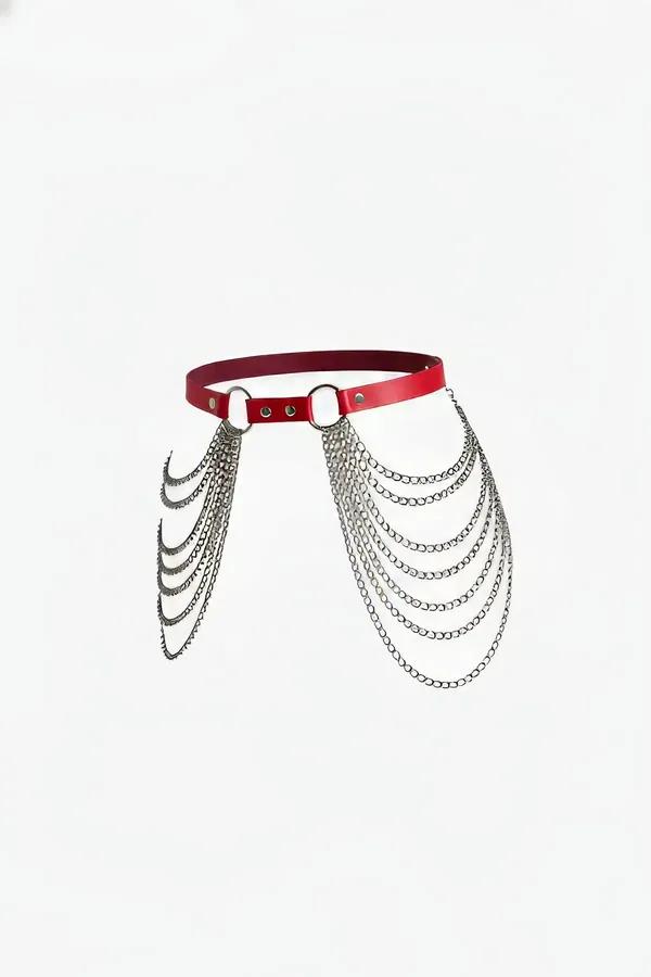 Red faux leather waist harness with five cascading silver-tone chain tiers and center O-ring, front view on white background