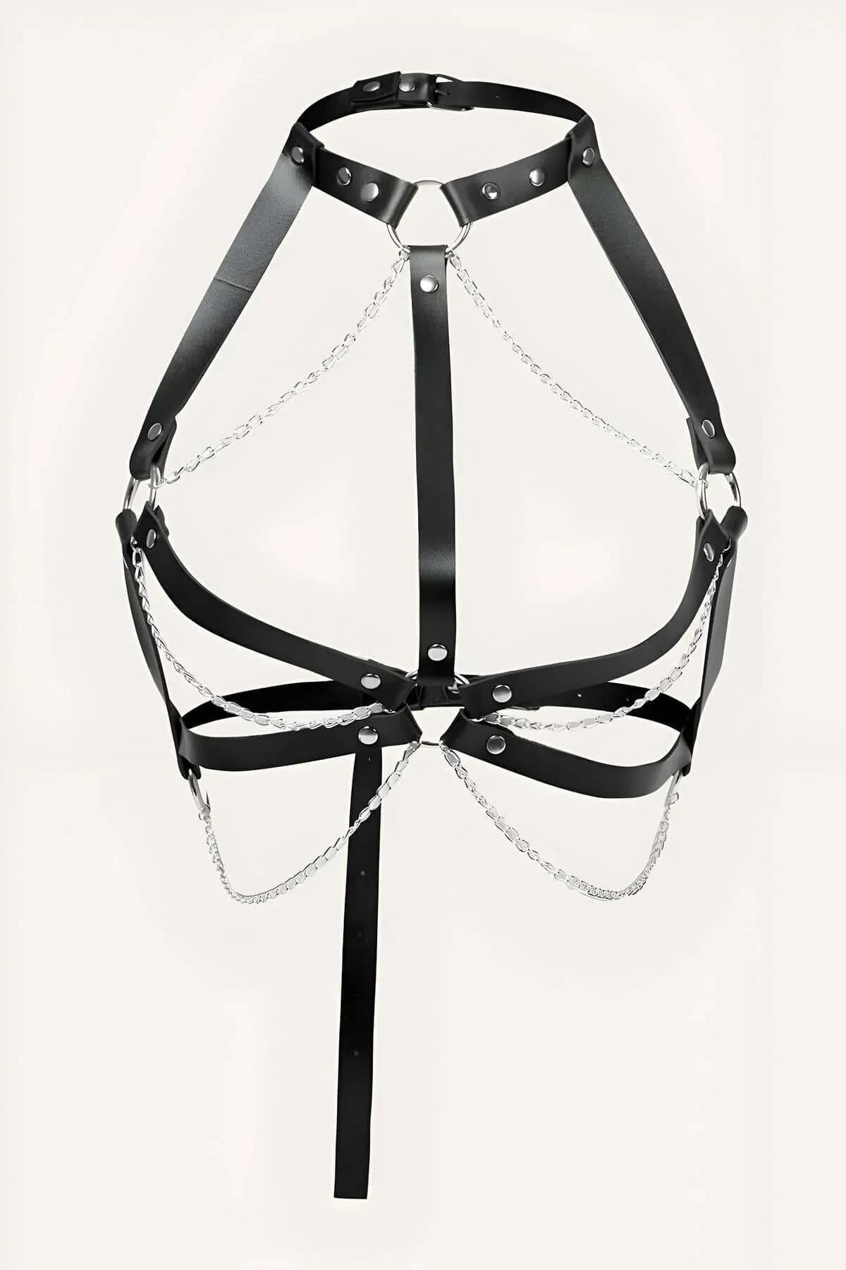 Close-up of black PU faux leather chest harness showing chrome rivets and silver chain drape detail