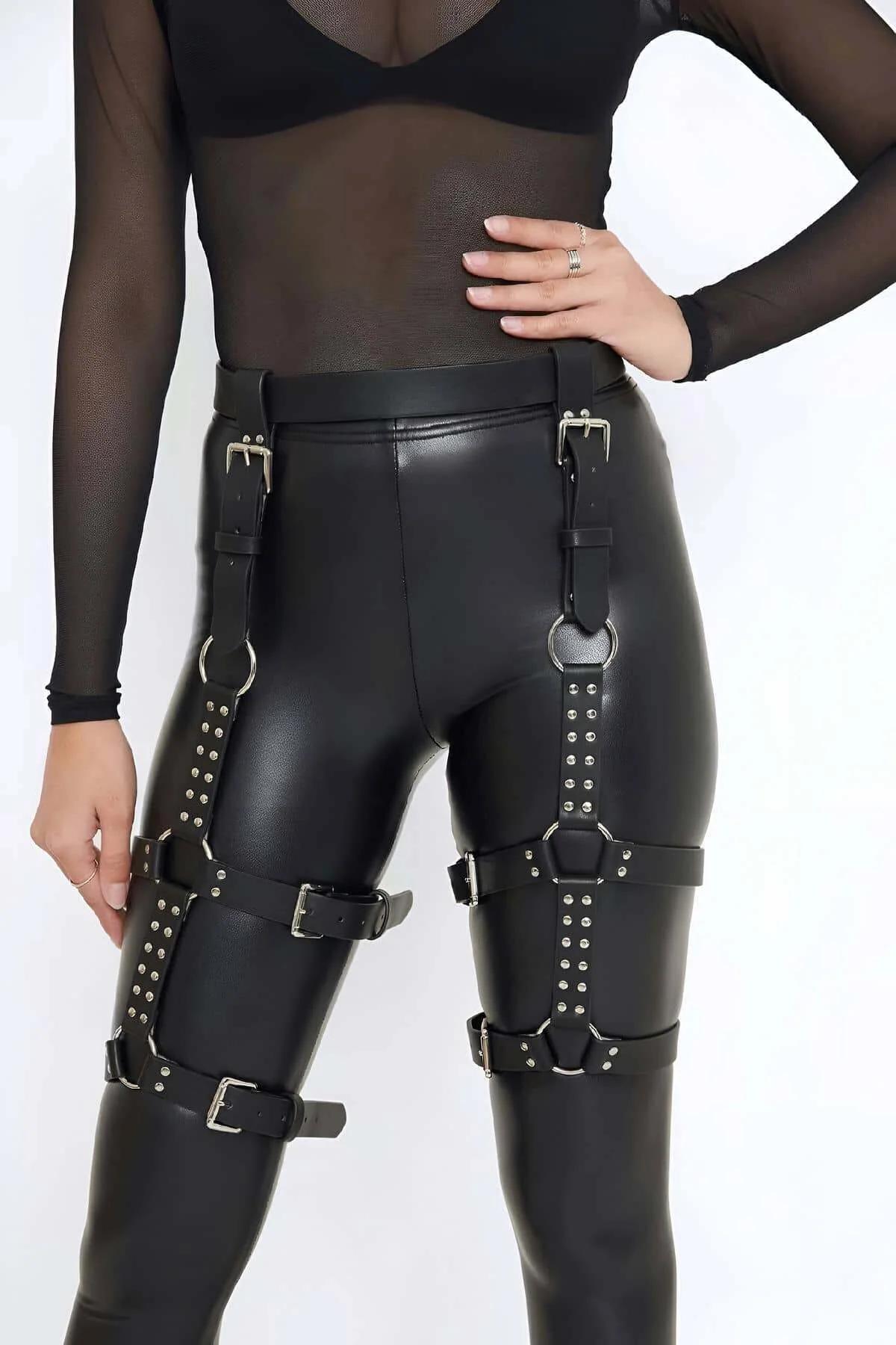 Close-up of silver stud rows and buckle hardware on black PU faux leather thigh strap panels