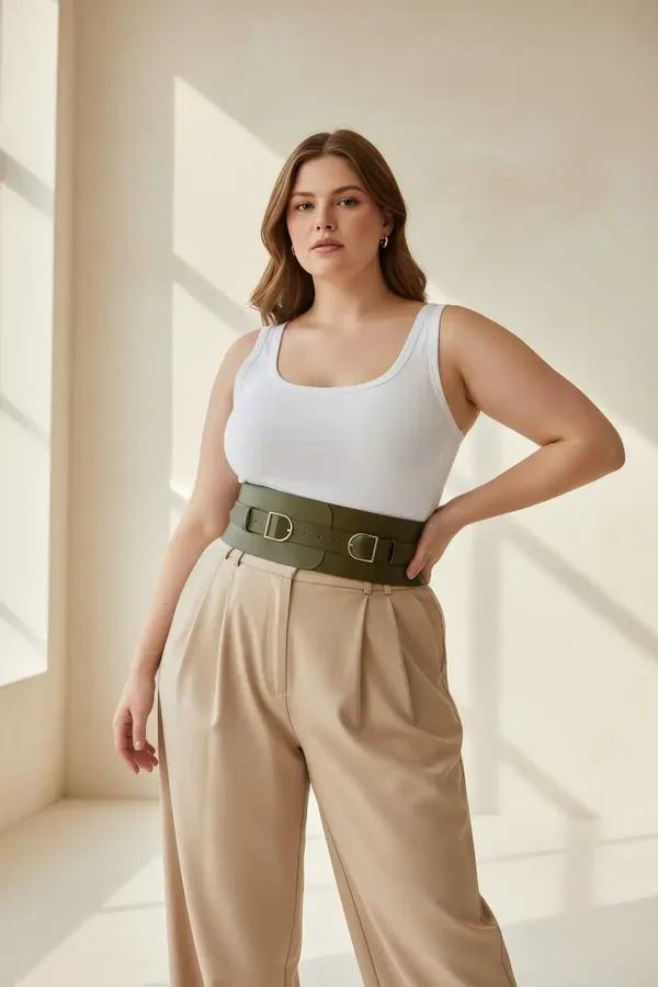 olive green wide waspie waist belt double silver buckles smooth vegan leather 11 cm worn over white tank and beige trousers