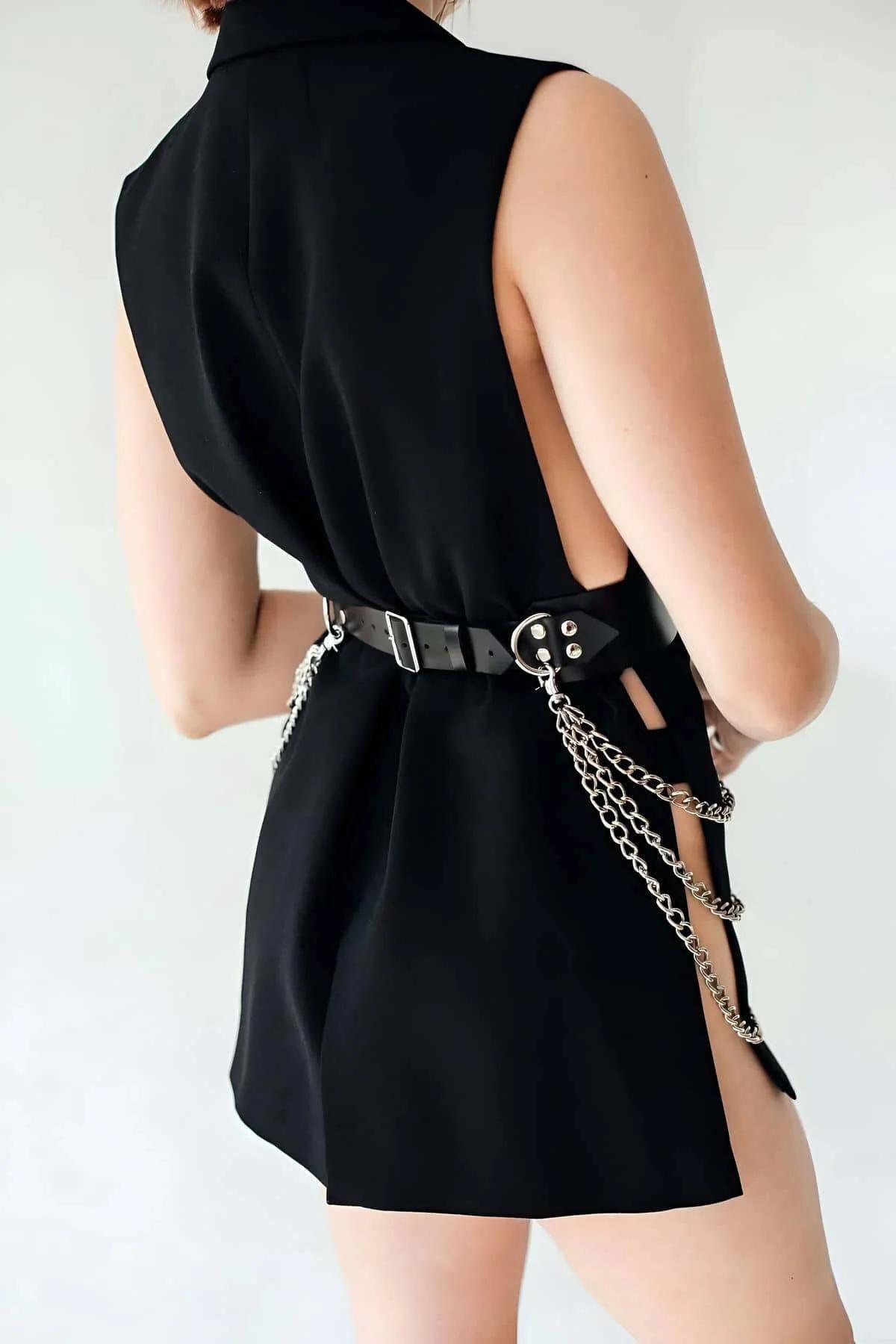 Side view of black chain waist belt showing five curb-link silver chain strands draping across hip