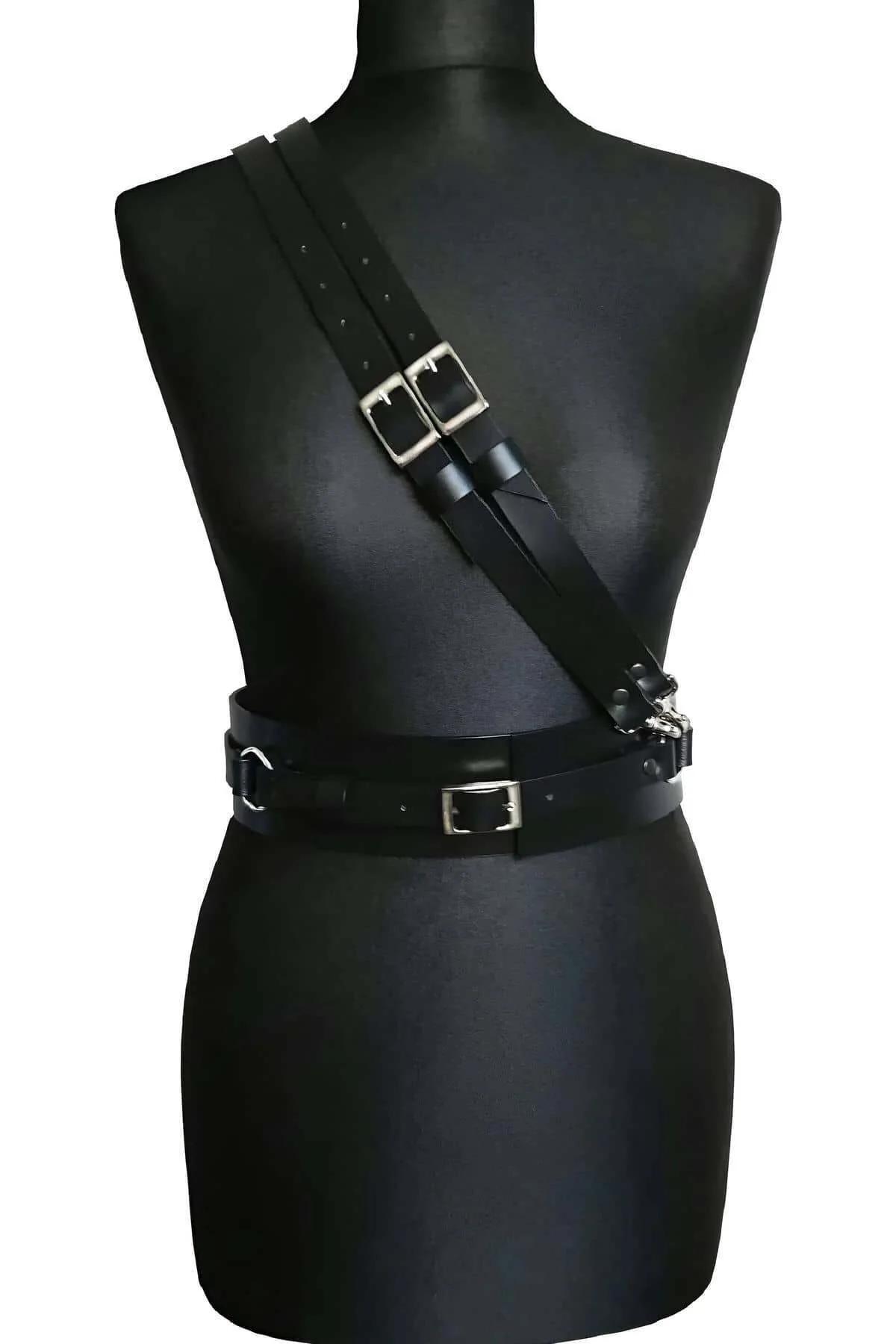 adjustable side buckle closure on black faux leather harness waist belt