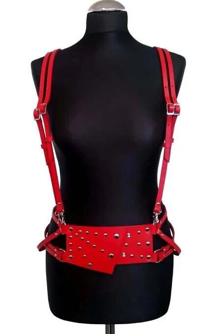 Close-up of silver dome studs on red PU leather waist panel of adjustable body harness