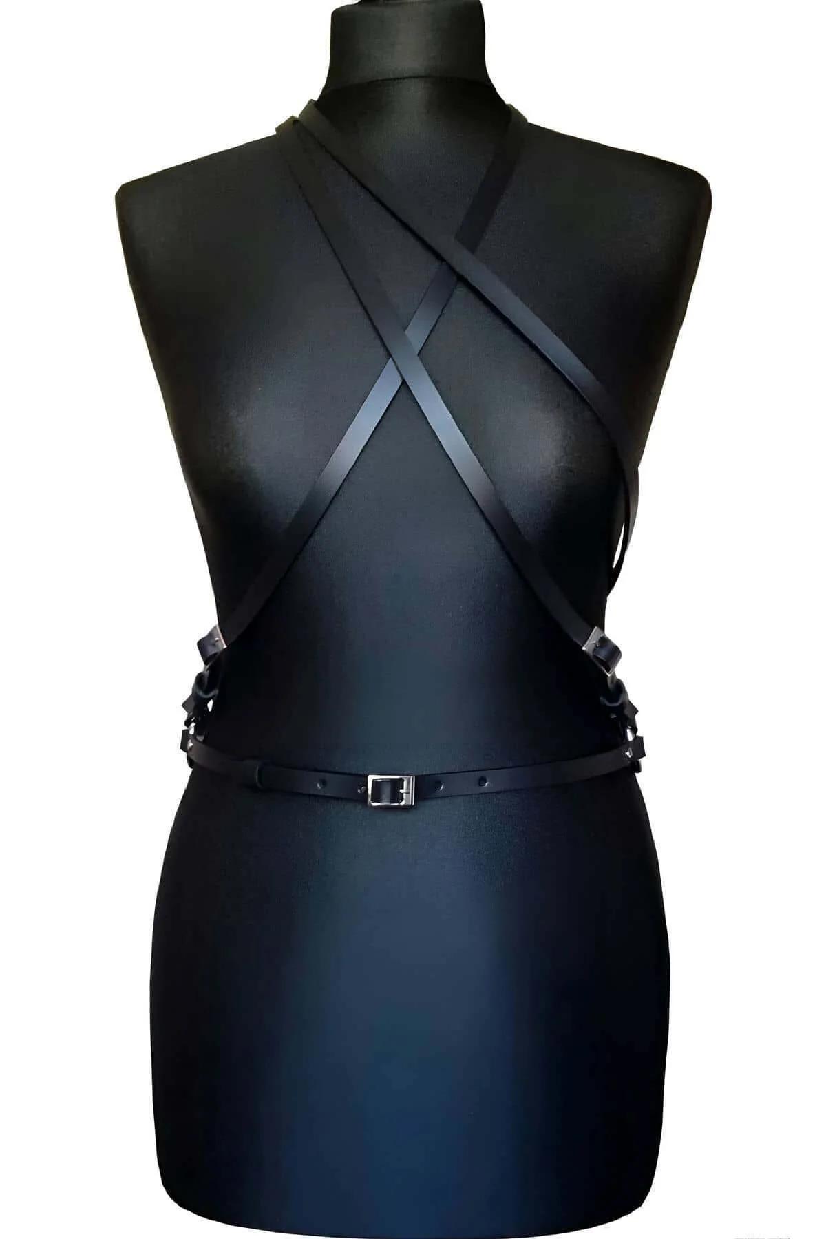 adjustable black faux leather waist belt with silver pin buckle close-up
