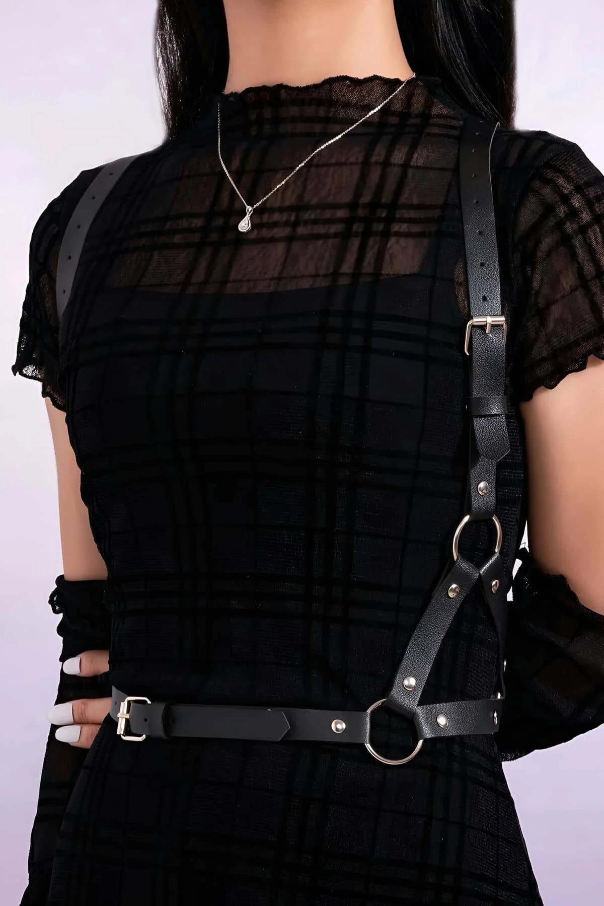 black diagonal harness adjustable waist belt with rectangular prong buckles detail