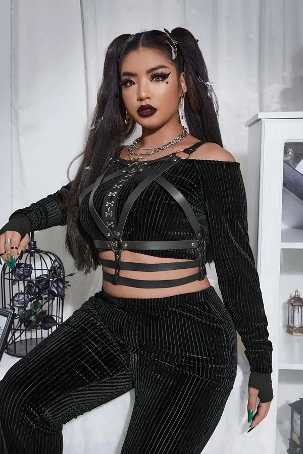Black faux leather body harness with cross-chest straps, silver O-ring center, three horizontal waist cage bands, and silver 