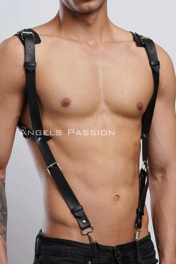 Black faux leather mens body harness with diagonal cross-body strap and silver roller buckles worn on bare chest