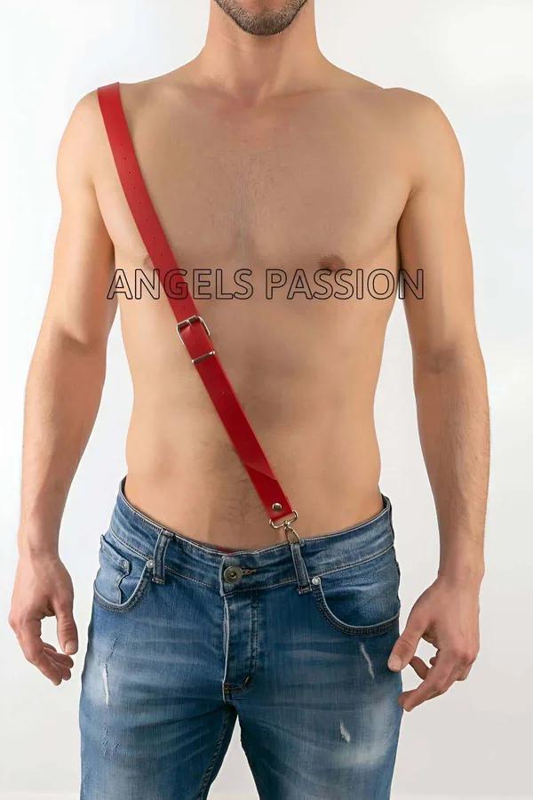 Red faux leather adjustable diagonal chest strap harness with silver buckle and hook clip worn over jeans