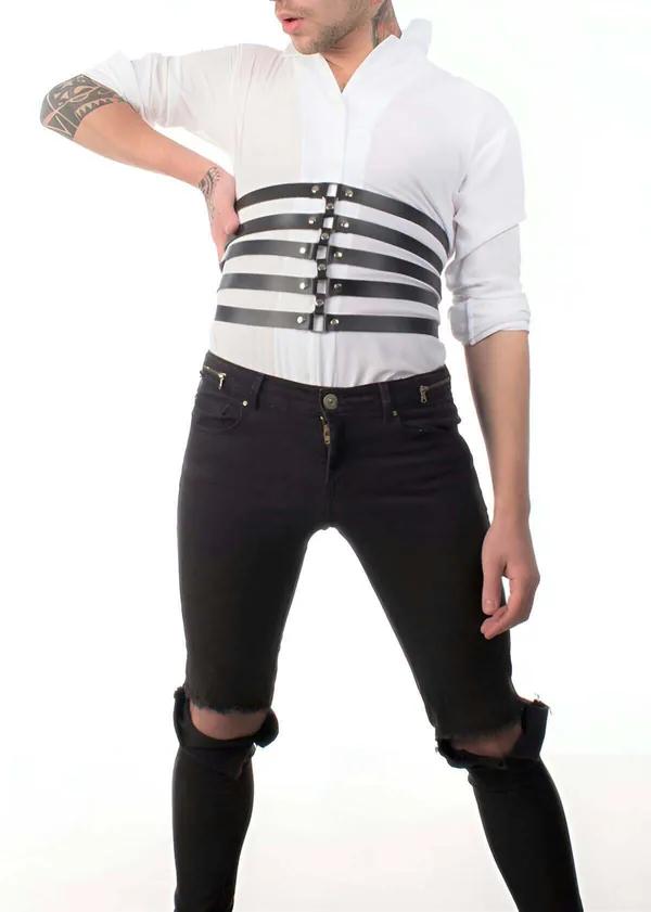 Black faux leather five-strap waspie harness with silver snap studs worn over white shirt