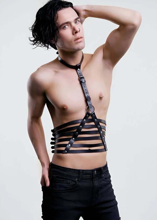black faux leather torso harness with five-strap waist cage and adjustable neck collar on male model