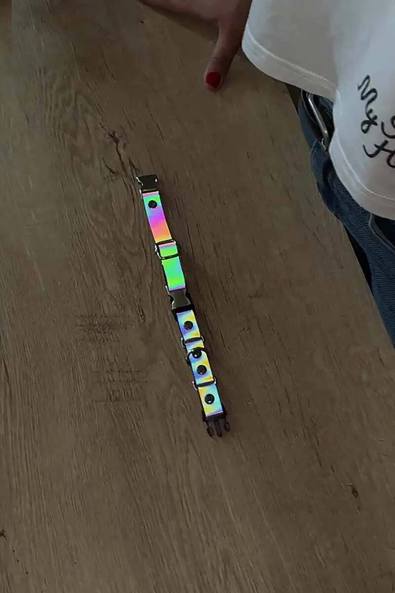 Silver O-ring eyelets detail on reflective rainbow choker band front view