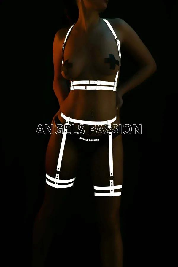 Reflective white strappy garter harness set with chest harness, waist belt, and double-band thigh garters on dark background